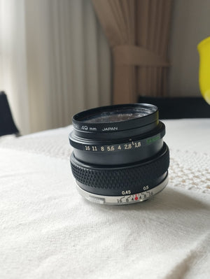 OLYMPUSOM Zuiko Auto-S 50 mm 1:1,8 427c434c-f003-4f93-b63e-2a5fe1a73414